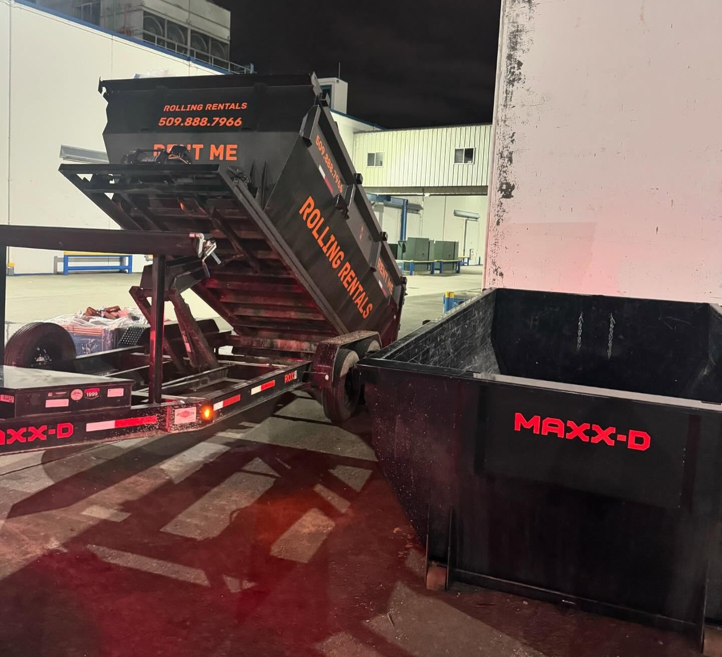 Rolling Rentals swapping out a full dumpster for an empty one in the Wenatchee Valley