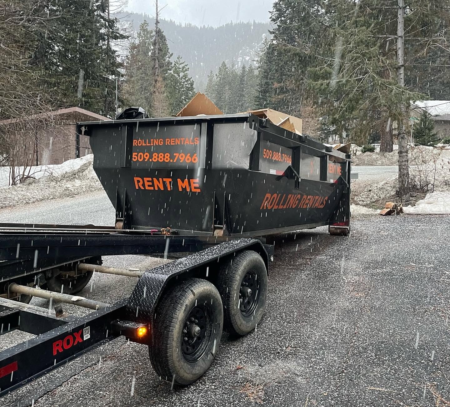 Rolling Rentals delivering a dumpster to a customer in Chelan County WA