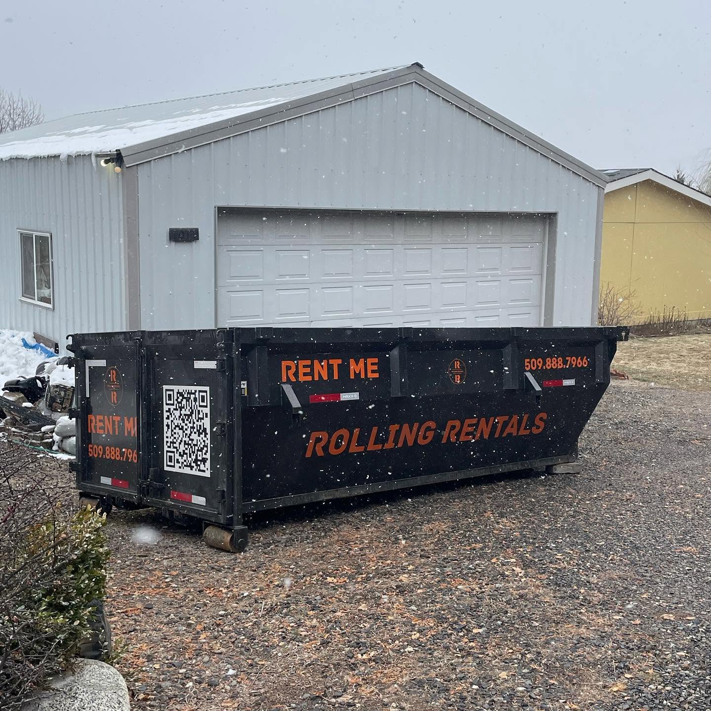 Rolling Rentals dumpster placed on a gravel driveway at a residential property in Chelan County WA