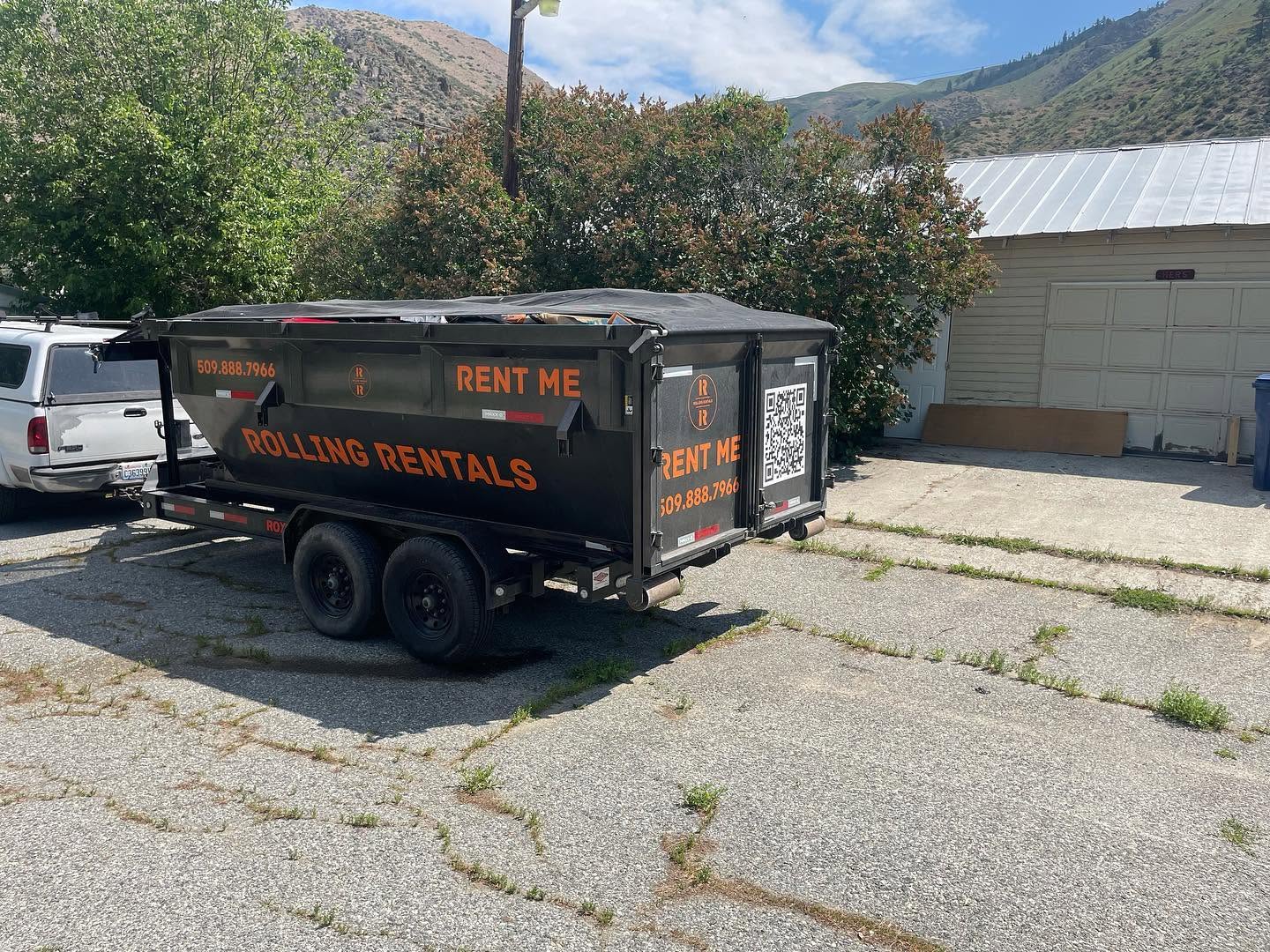 Rolling Rentals dumpster placed on the street at a jobsite in Chelan County WA