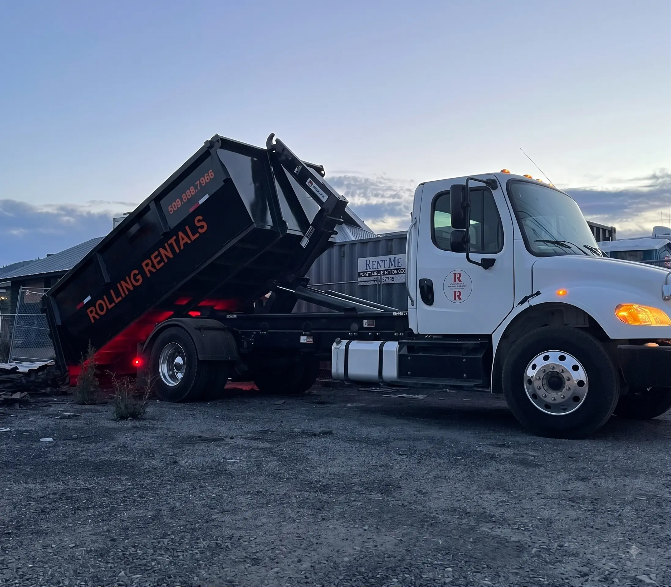 Rolling Rentals hooklift truck delivering a dumpster in the Wenatchee Valley